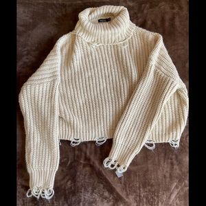 Knit cropped distressed turtleneck sweater